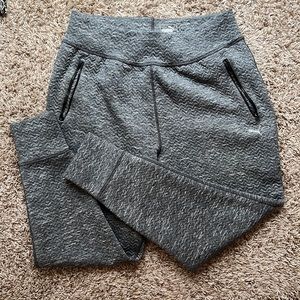 Grey puma sweatpants with zippered pockets